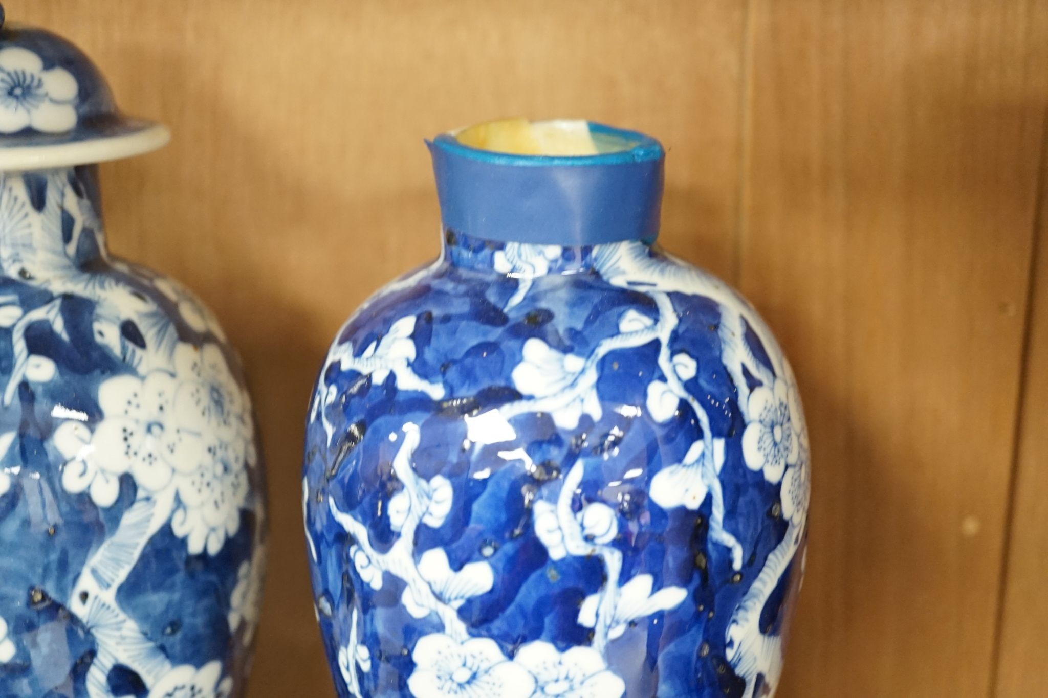 A pair of Chinese blue and white vases and eleven jars, six with covers., Vase and matching cover 28 cms high.